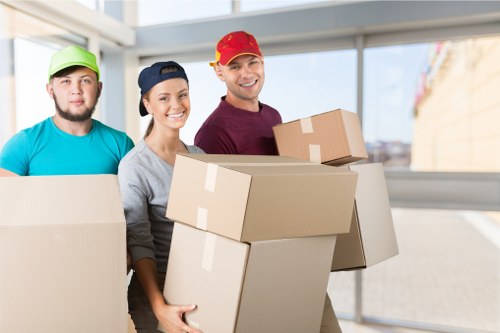 Removal team protecting furniture during a carefully managed move