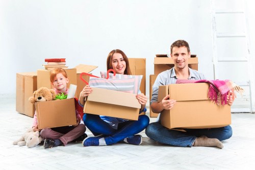 Team member safely handling boxes during a removals job