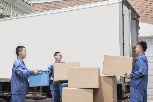 Moving van and packed boxes for a Paddington home move