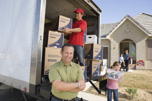 Professional movers handling boxes and furniture for a Paddington relocation