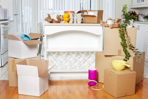 Professional movers handling packed boxes during a Paddington move