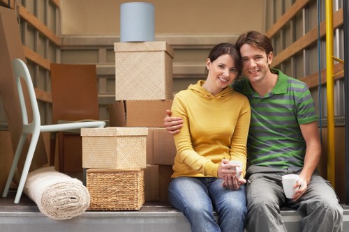 Office relocation process with labelled boxes and furniture transport
