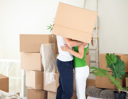 Professional movers handling furniture inside a Paddington apartment building
