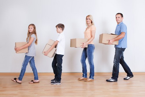 Paddington removals van handling boxes and household items